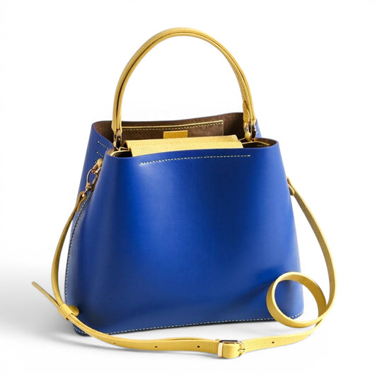 Blue and yellow leather handbag with handle and a strap