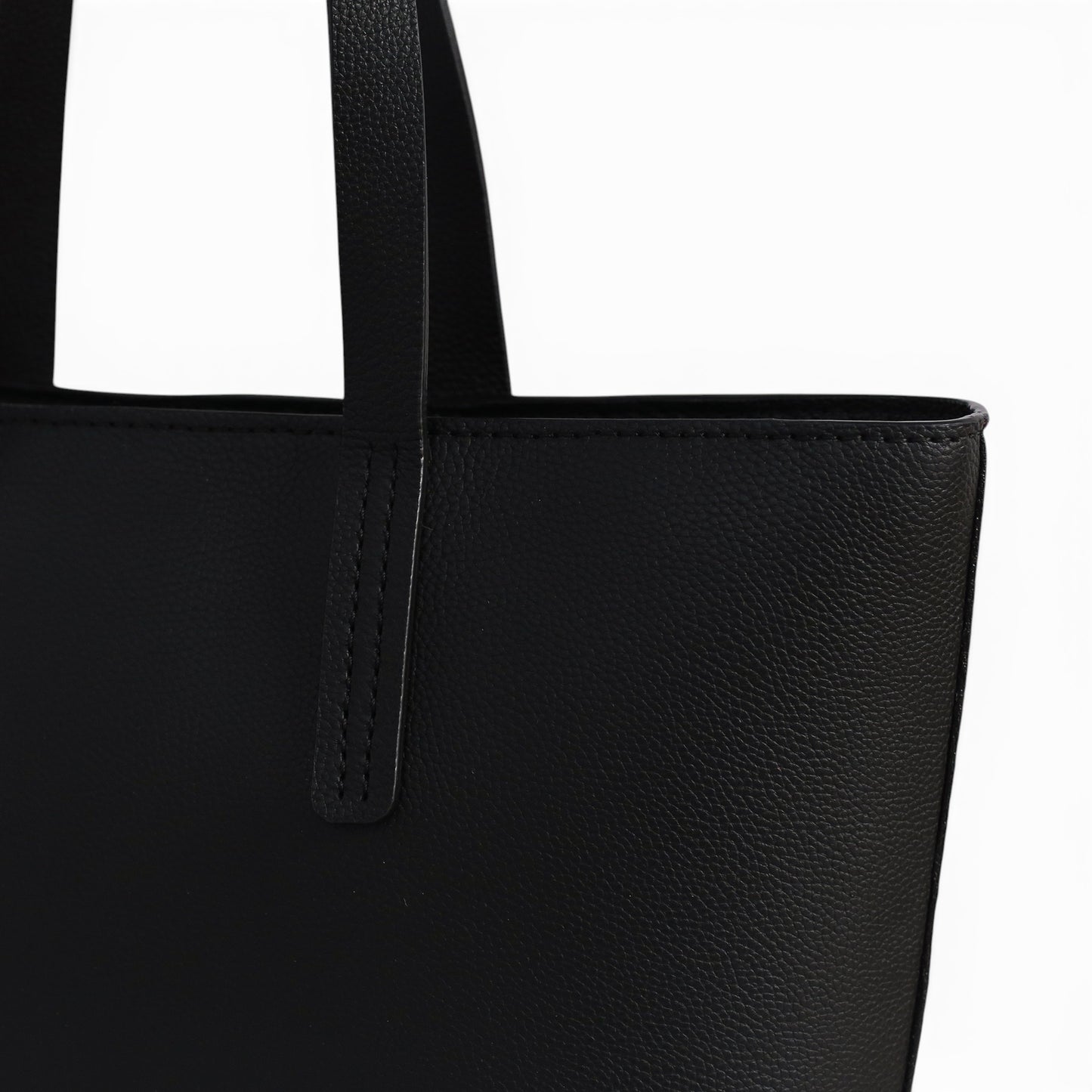 Close-up of a black leather shoulder bag