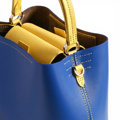 Blue and yellow leather handbag with  handle