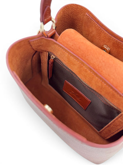 Brown leather handbag with a visible brand label