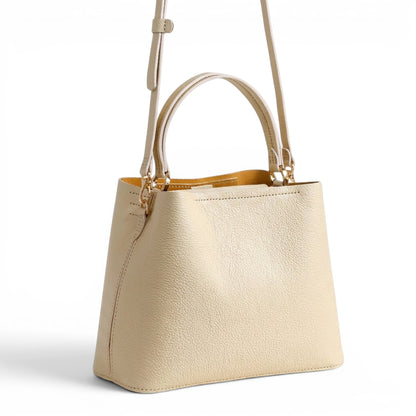 Cream leather handbag with a strap and handle
