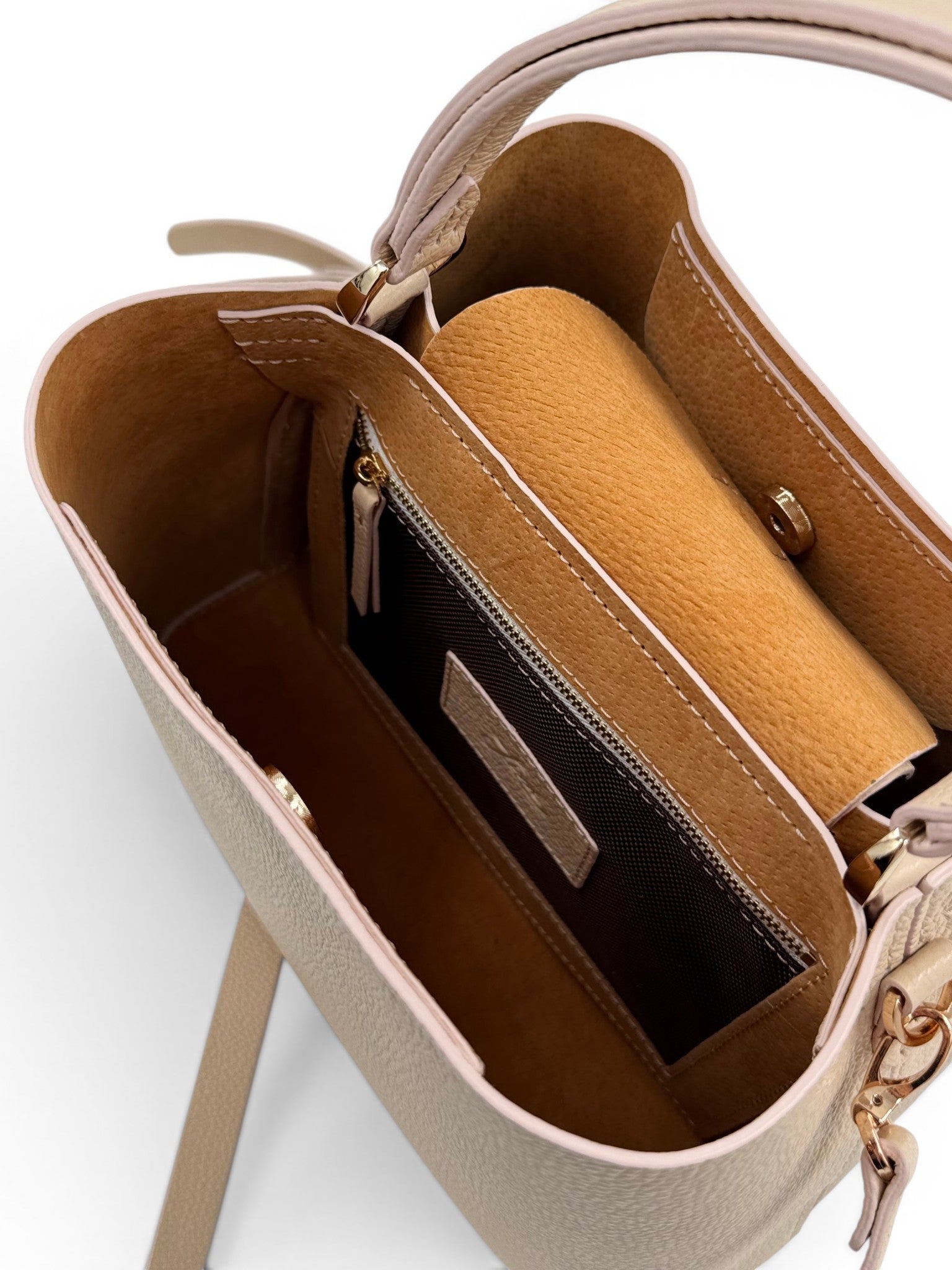 Open cream leather handbag showing interior