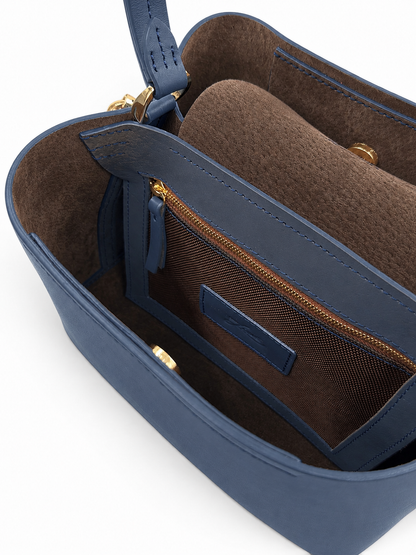 Blue handbag with brown interior