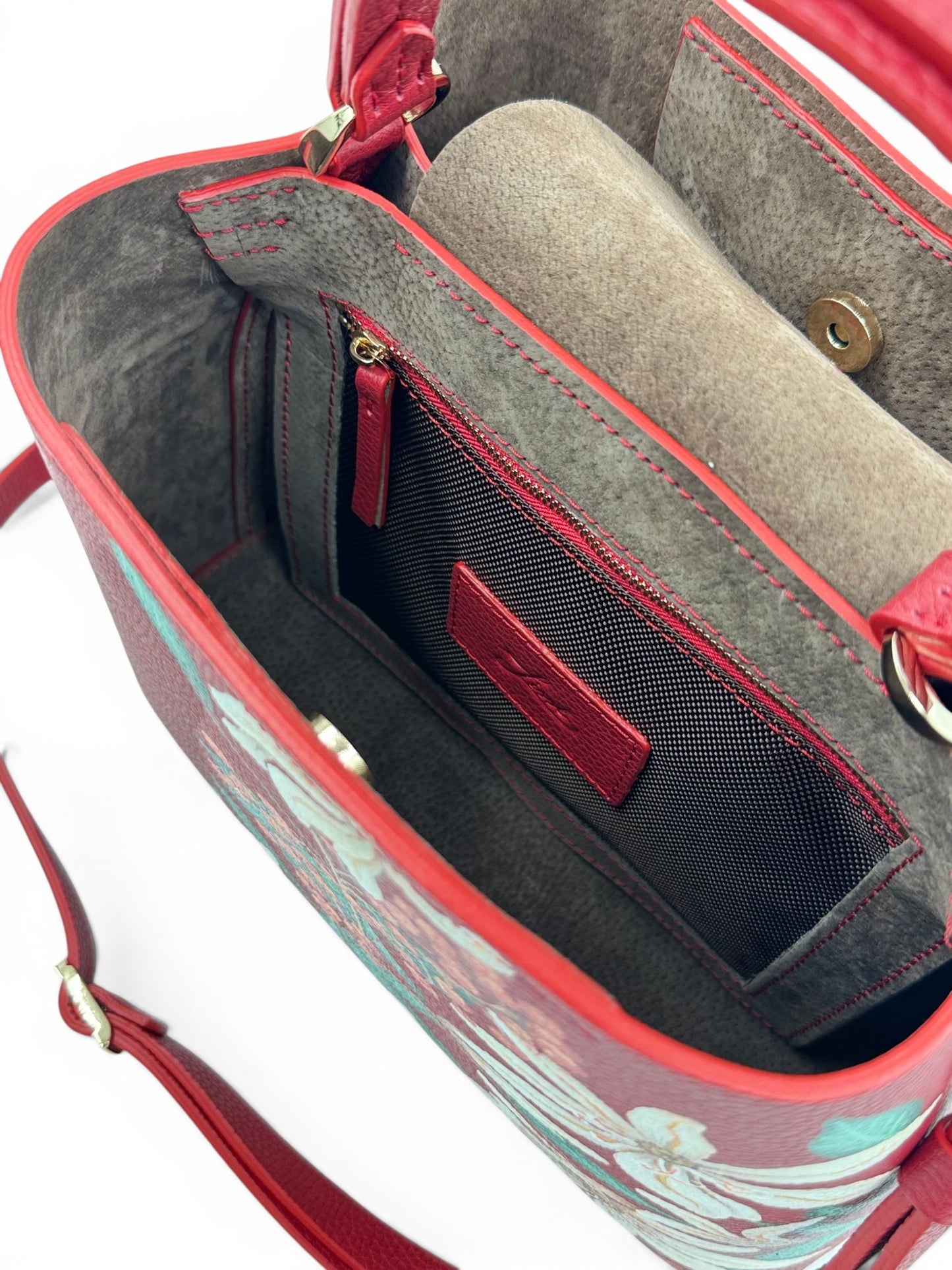 Open Leather handbag revealing a gray interior, Honey collection