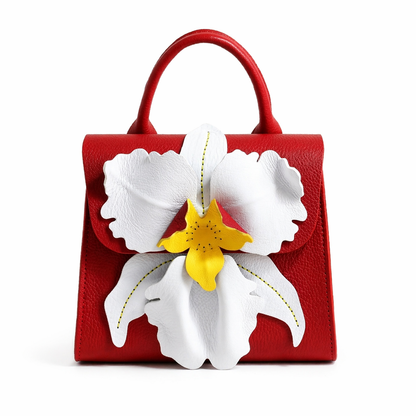 Red full grain leather handbag with a large white orchid flower