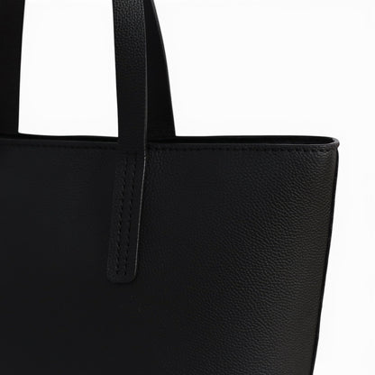 Close-up of a black leather shoulder bag 