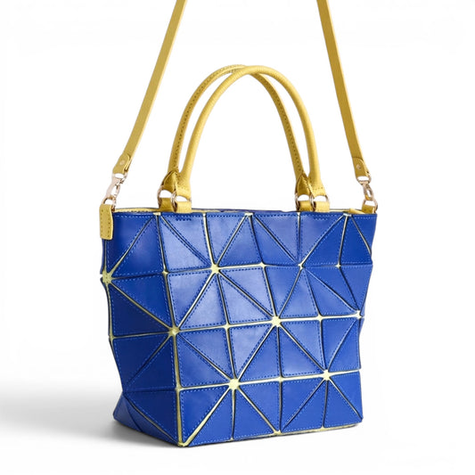 Blue and yellow leather handbag with geometric patches and floral design