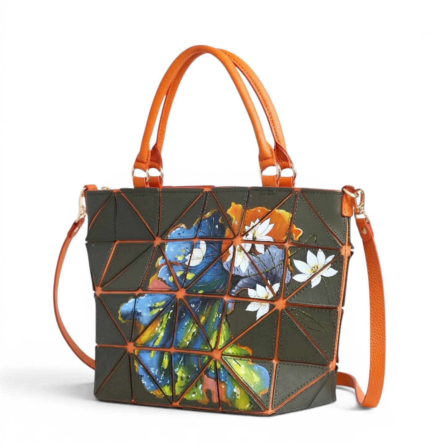 Dark green leather handbag with geometric patches and floral design