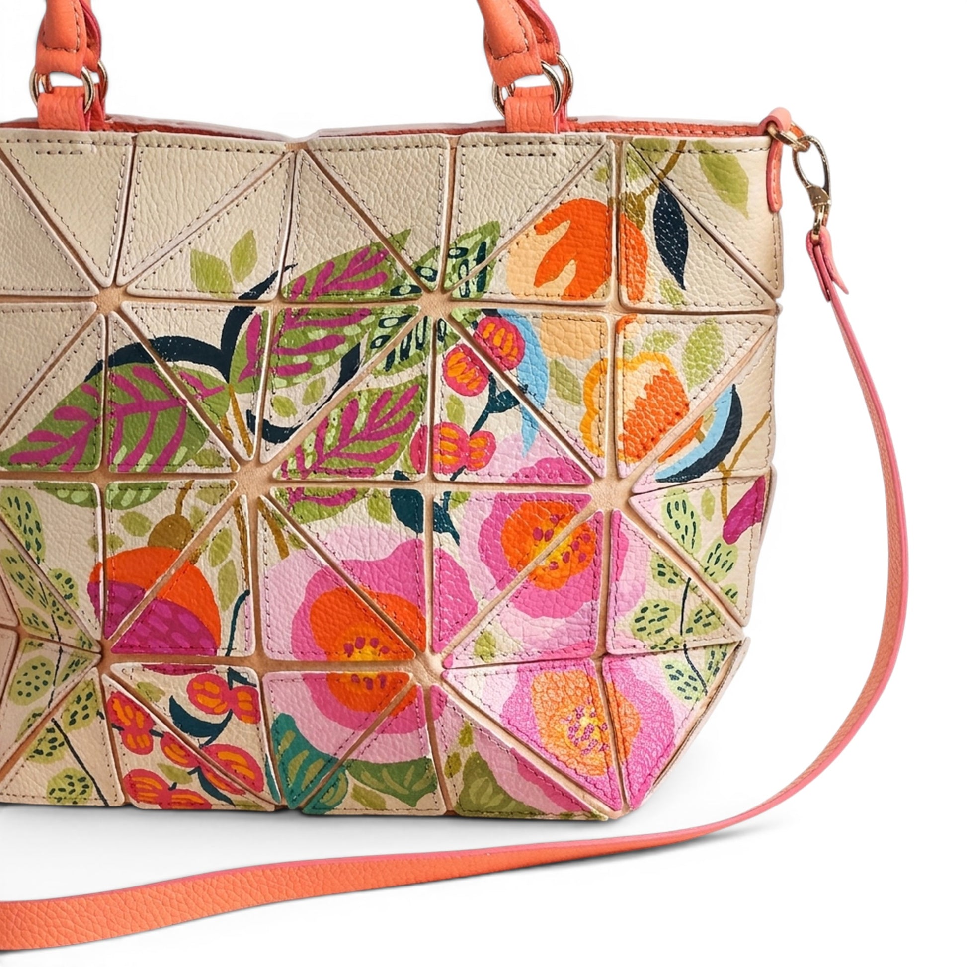 Cream leather handbag with colorful floral design and patches