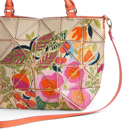 Cream leather handbag with colorful floral design and patches