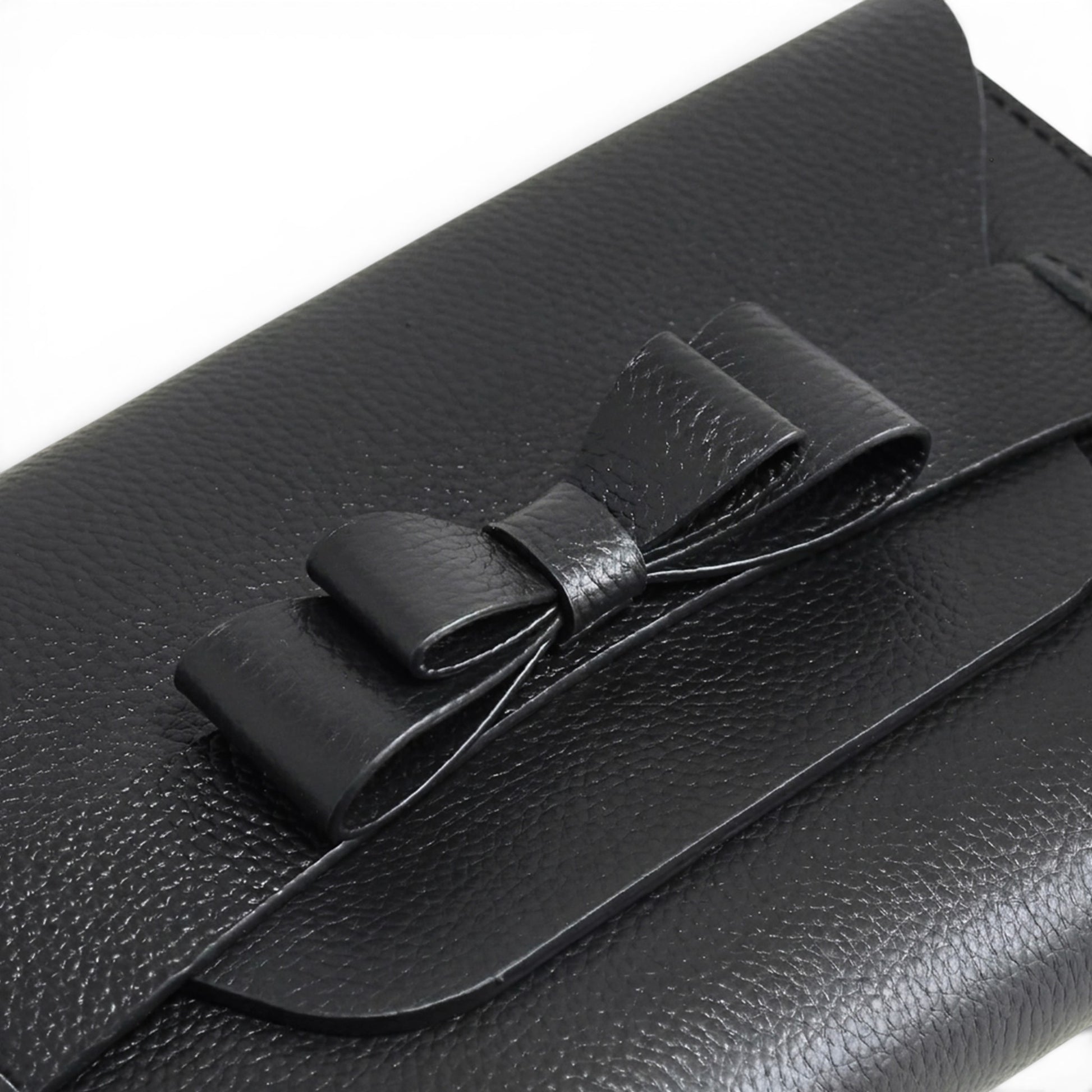 Black leather clutch bag with a bow 