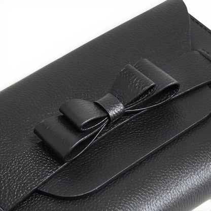 Black leather clutch bag with a bow 