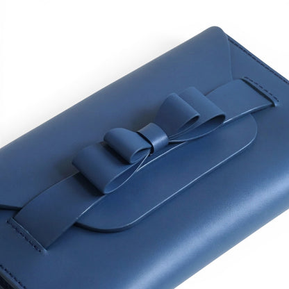 Blue leather clutch bag with a bow