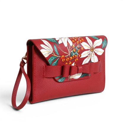 Red leather handbag with floral design