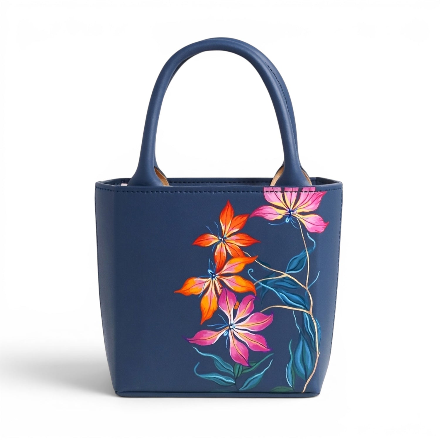 Blue leather handbag with floral designs on a white background