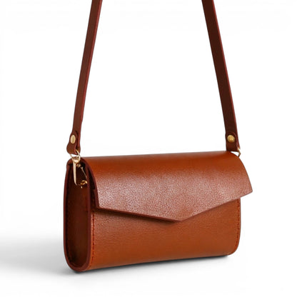 Brown leather clutch bag with a strap