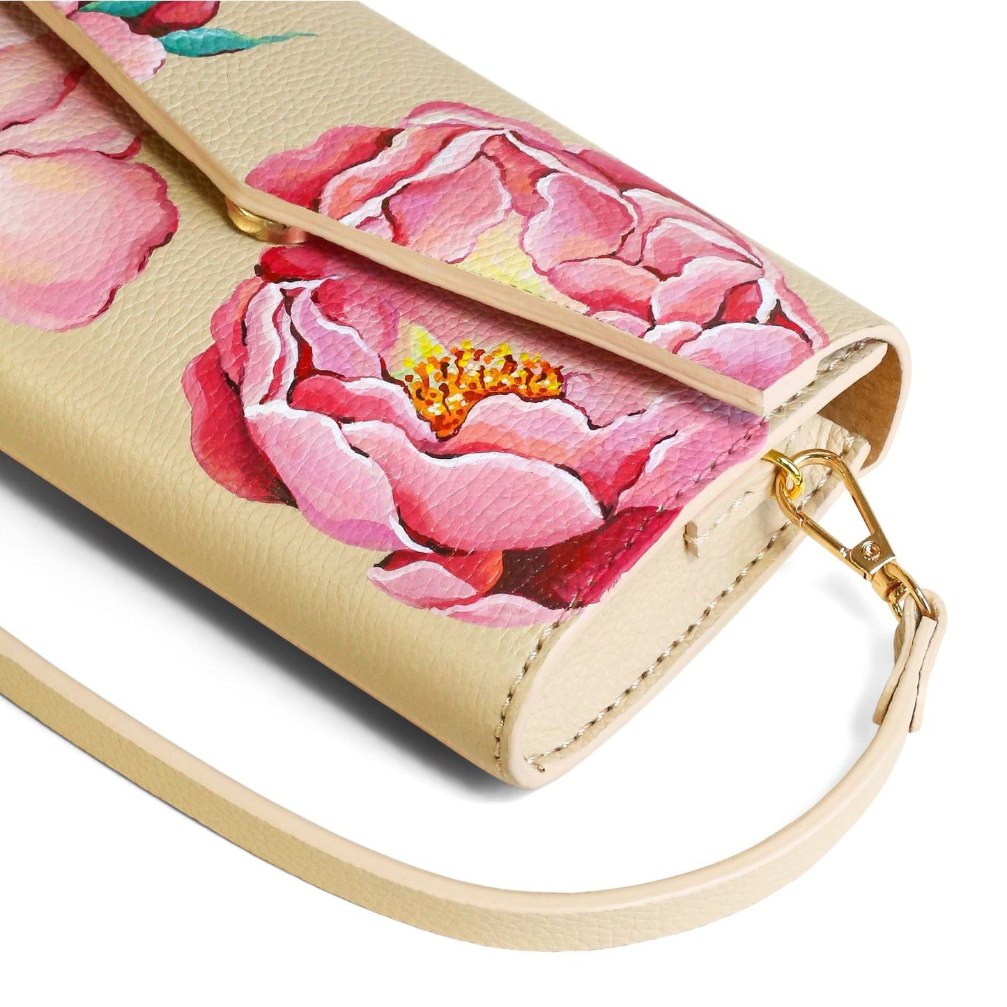 Floral patterned handbag with pink flowers on a beige leather