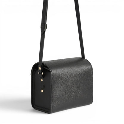 Black leather handbag with a strap