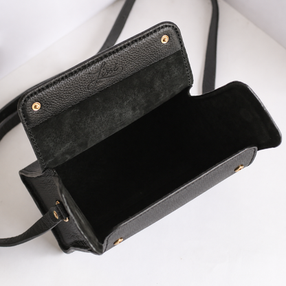 Inside Black leather handbag with gold hardware