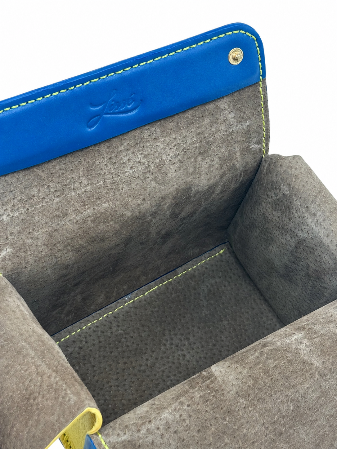 Blue and yellow leather crossbody bag with soft leather lining interior and visible brand logo.