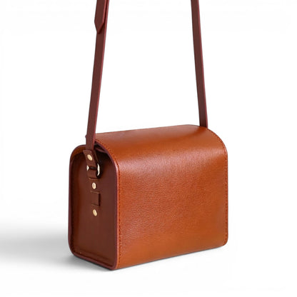 Brown leather handbag with a strap
