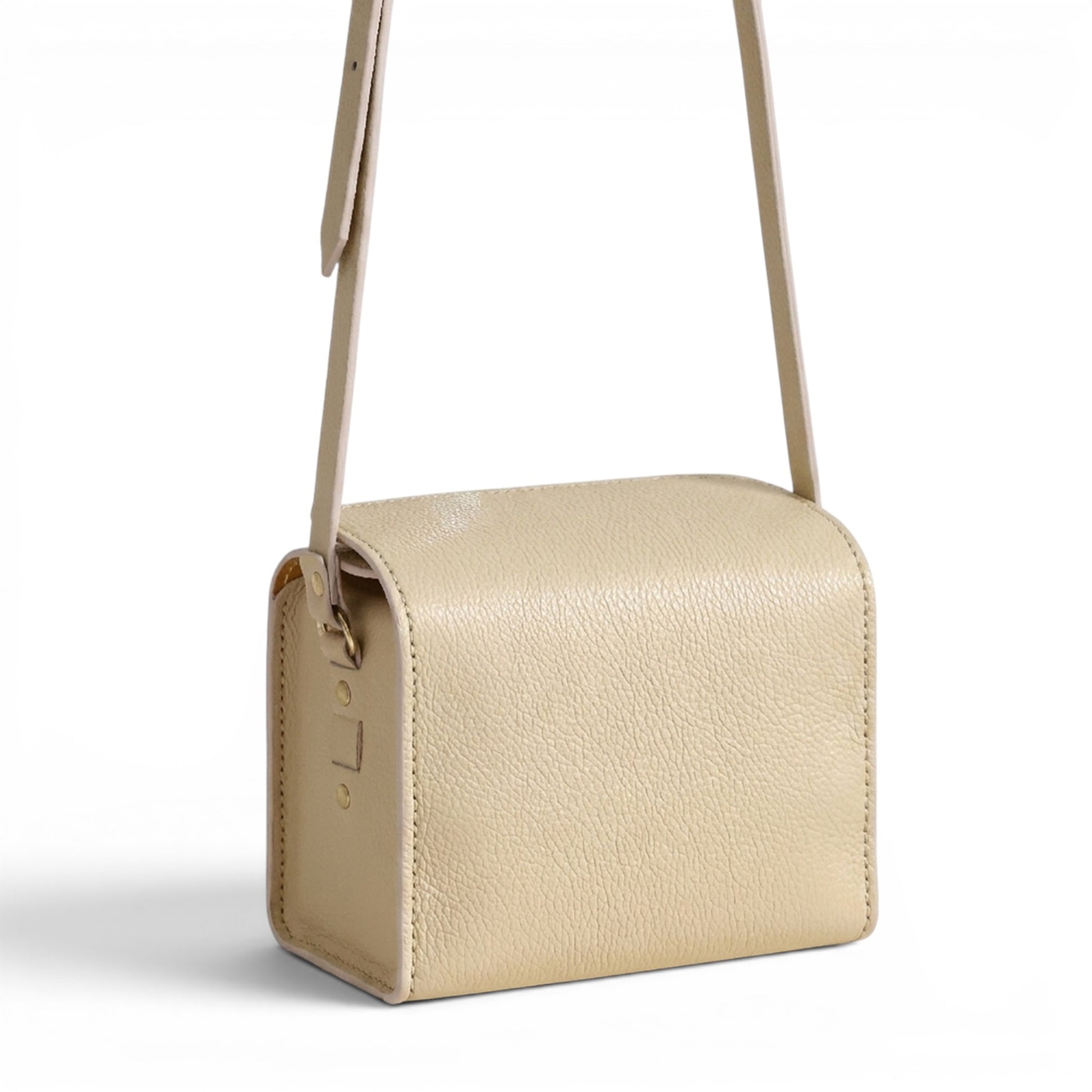 Cream leather handbag with a strap
