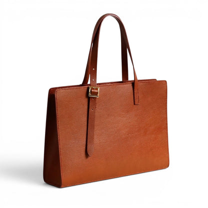 Brown leather shoulder bag with a gold clasp