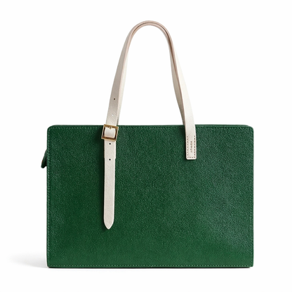 Green leather handbag with a white strap