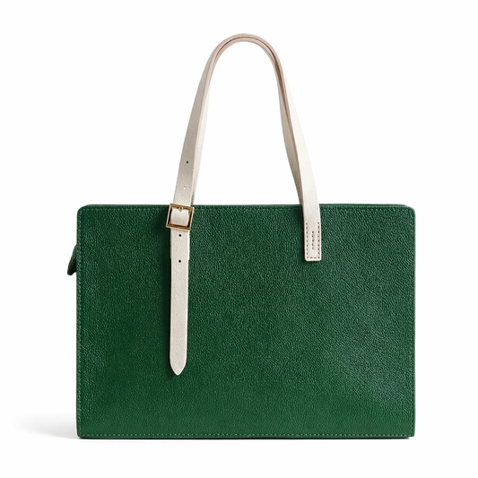 Green leather handbag with a white strap