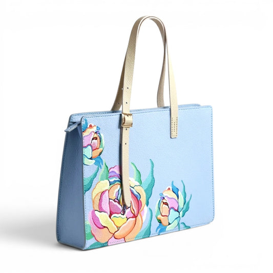 Light blue leather handbag with floral design